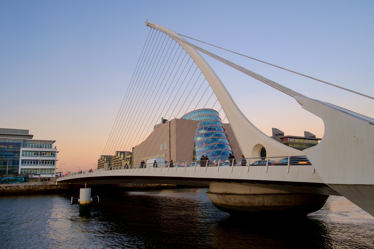 A photo of the Samuel Beckett Bridge in Dublin cit taken at sunset.